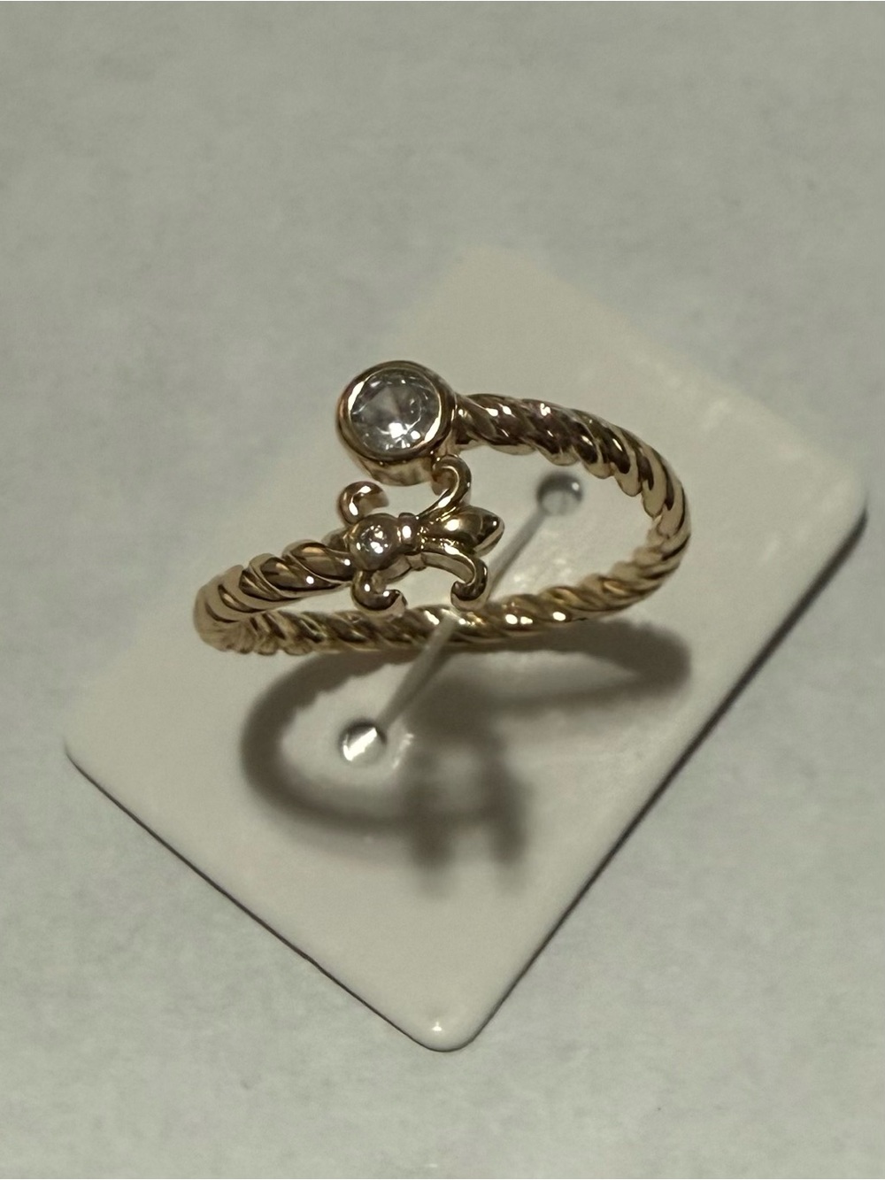14k Gold Electroplated Twisted Band Ring with Clear Stone and Fleur Accent